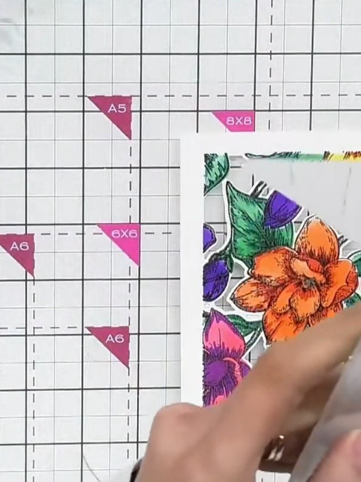 Step 6: Insert your die-cut floral panel into the 3D embossing folder, ensuring the coloured design is positioned corr