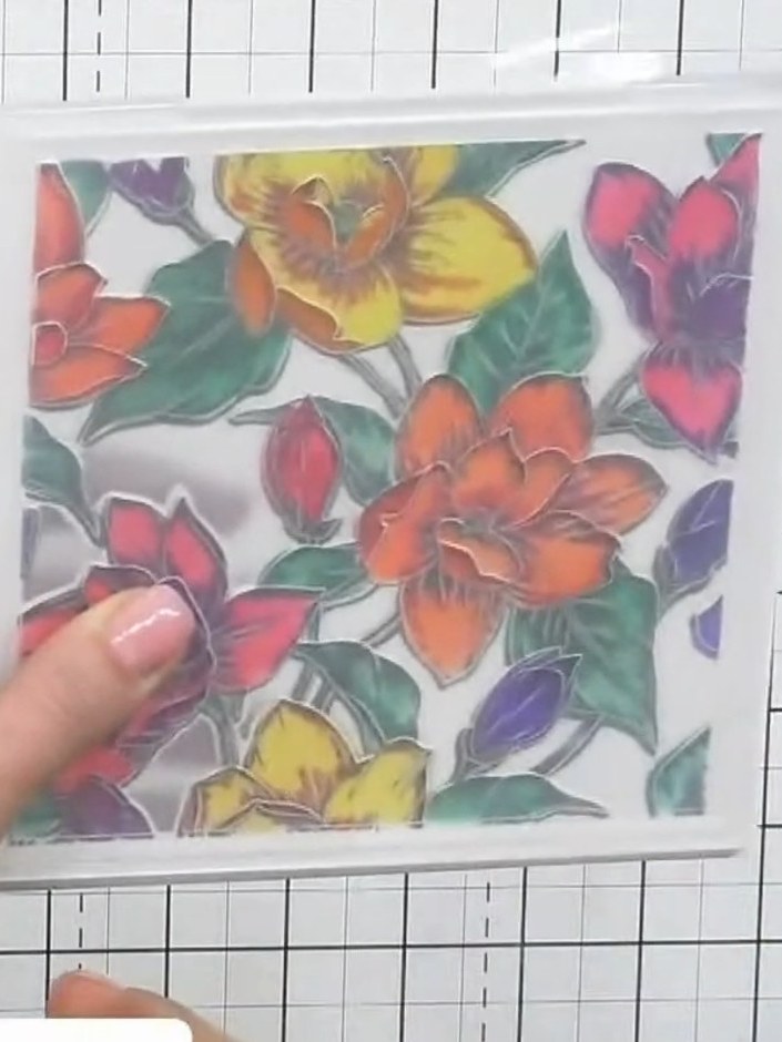 Step 7: Place your coloured floral design into the embossing folder and run it through your die-cutting machine to cre
