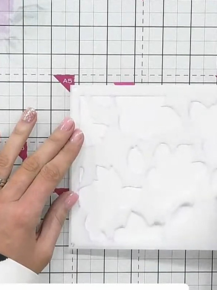 Step 1: Place stencil number one on your white cardstock and apply ink through it using an ink brush, pressing lightly