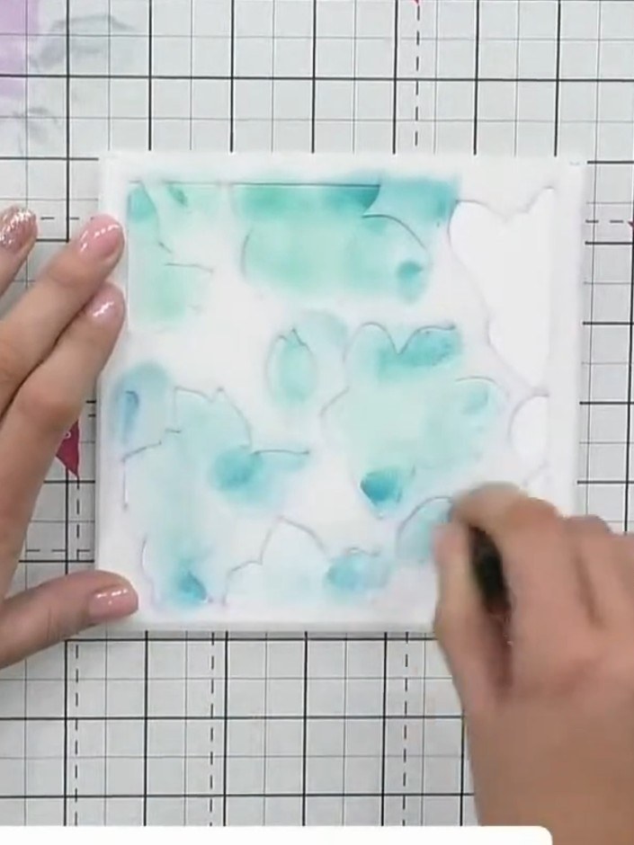 Step 2: Place stencil number three (the leaves design) over the same area of your card. Using a blending sponge, apply