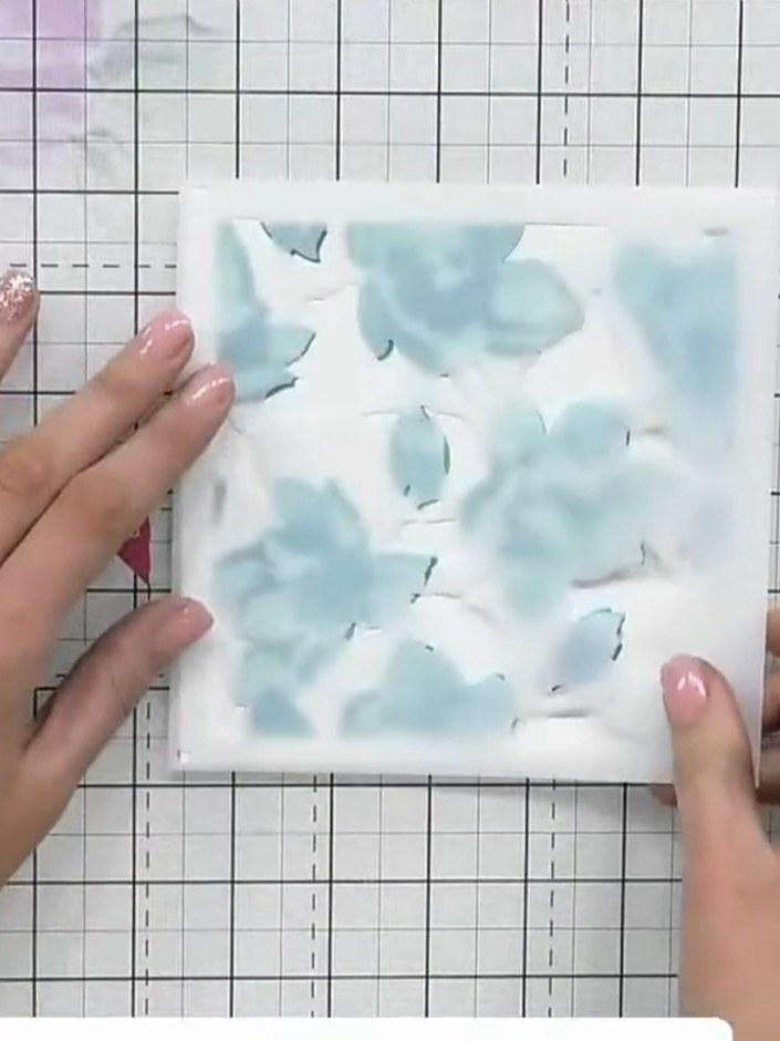 Step 3: Apply the fourth stencil (flower centres) using a darker ink colour. Press slightly harder with the blending t