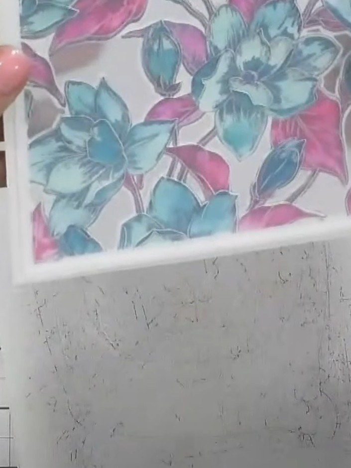 Step 9: Carefully pop out all the die-cut elements from the frame to reveal the finished layered magnolia design with 